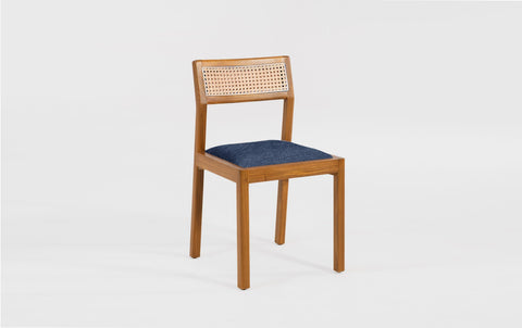 reddie-raw dining chair Rita Rattan Dining Chair