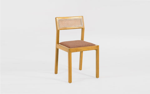 reddie-raw dining chair Rita Rattan Dining Chair