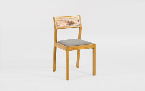 reddie-raw dining chair Rita Rattan Dining Chair