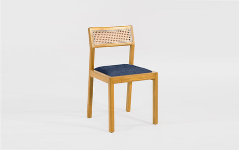 reddie-raw dining chair Rita Rattan Dining Chair